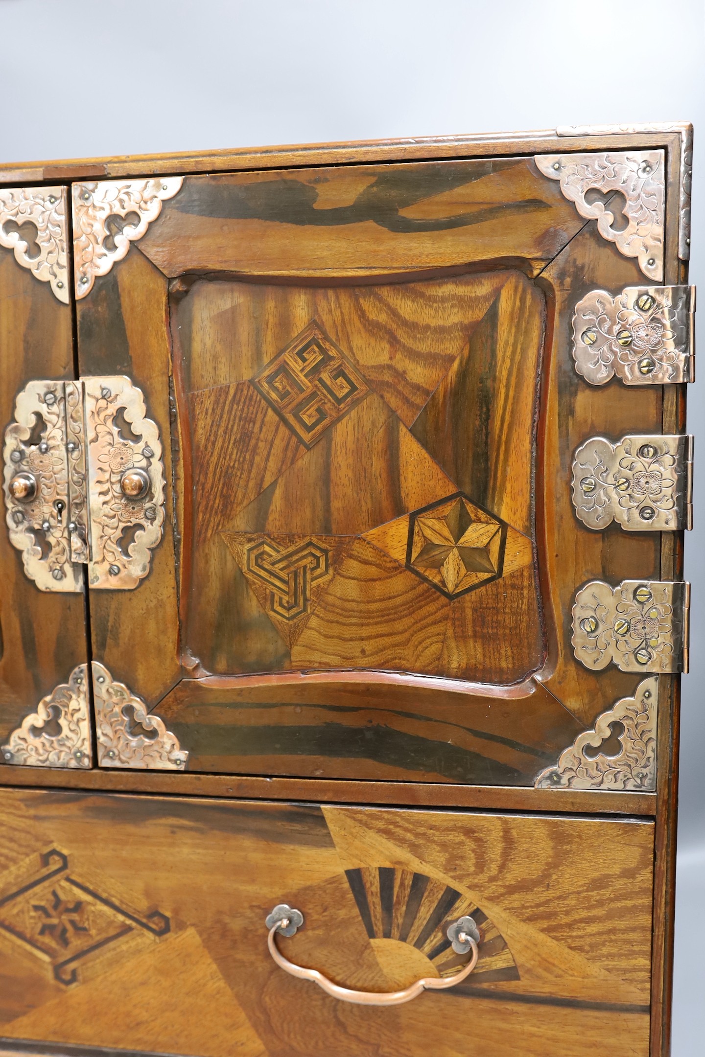 A 19th century Japanese Hakone parquetry table top chest, 55 cms wide x 46.5 cms high.
